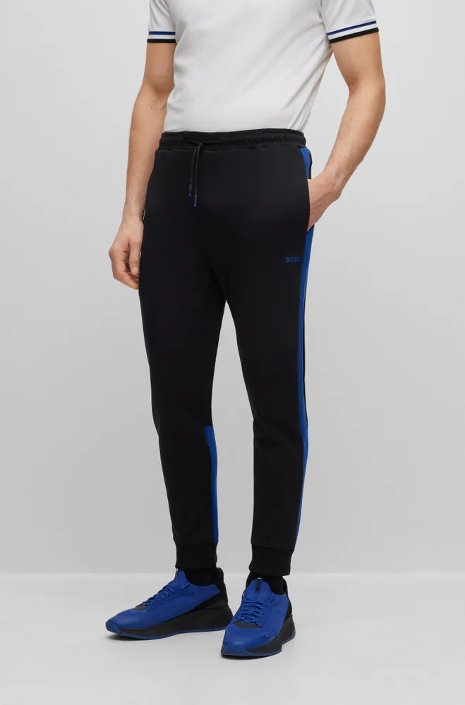 BOSS - Monogram-print tracksuit bottoms with signature-stripe tape