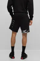 Relaxed-fit cotton shorts with graffiti-inspired logo
