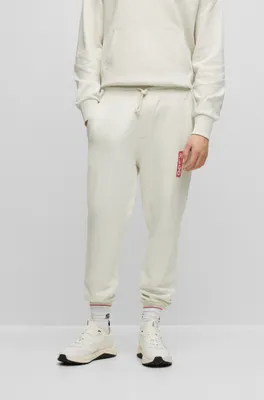 Cotton-terry tracksuit bottoms with vertical logo