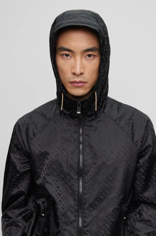 Water-repellent down jacket with monogram badge and lining