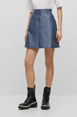 Leather mini skirt with denim print