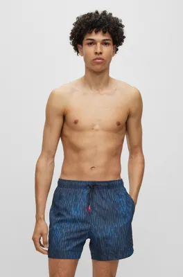 Quick-drying swim shorts with signature print