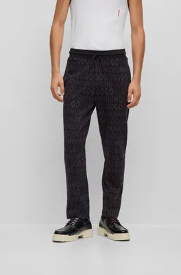 Cotton tracksuit bottoms with drawstring waist and monogram jacquard