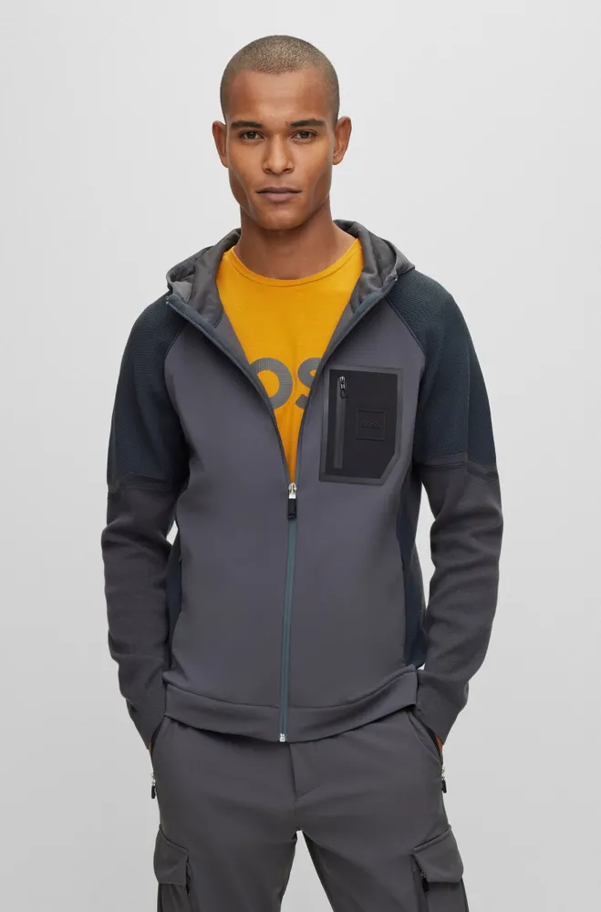 Mixed-material hooded jacket with signature pocket