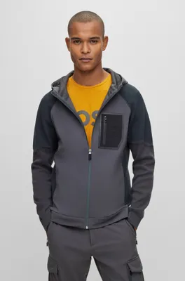 Mixed-material hooded jacket with signature pocket