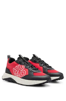Mixed-material trainers with stacked logo