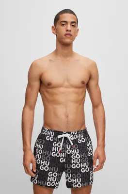 Swim shorts with all-over logo print