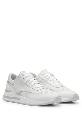 Low-top trainers with perforated and plain leather