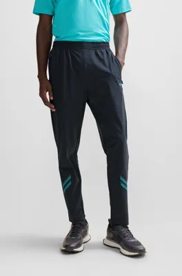 Regular-fit tracksuit bottoms with decorative reflective artwork