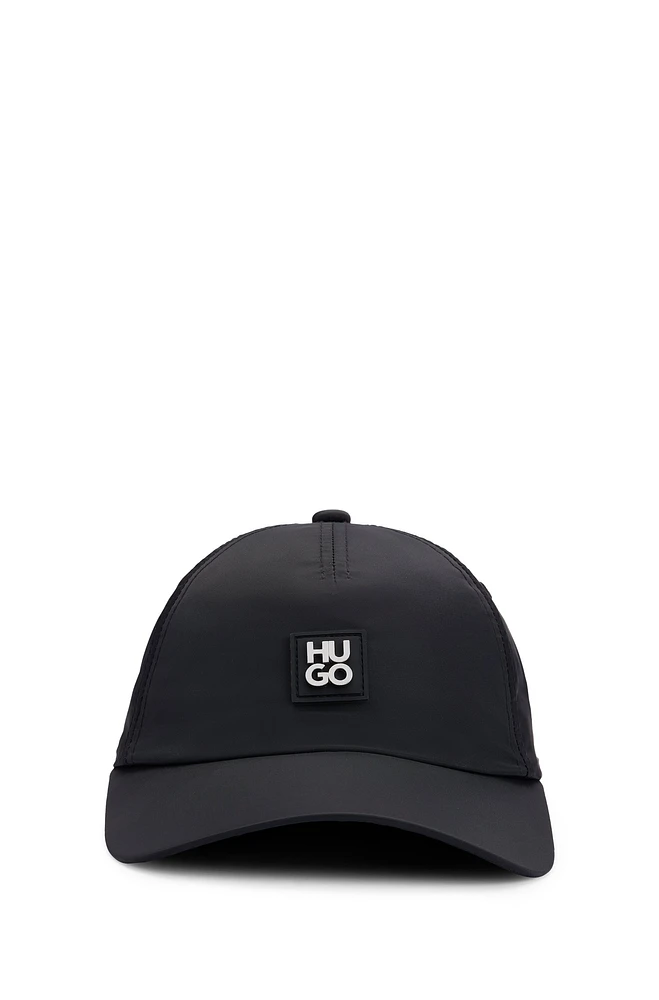 Waterproof cap with metallic stacked logo