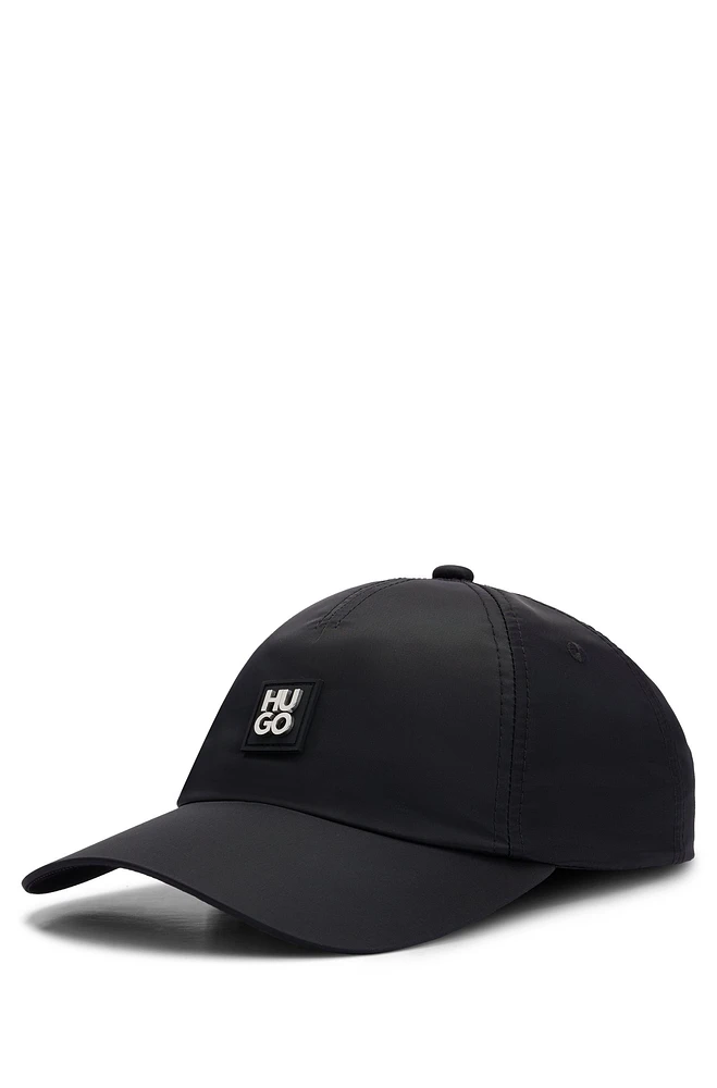 Waterproof cap with metallic stacked logo