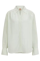 Relaxed-fit blouse with concealed placket and point collar