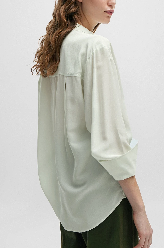Relaxed-fit blouse with concealed placket and point collar
