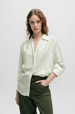 Relaxed-fit blouse with concealed placket and point collar