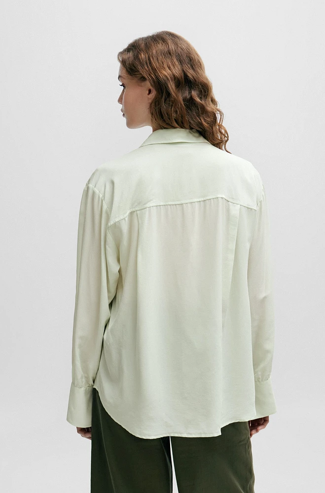 Relaxed-fit blouse with concealed placket and point collar