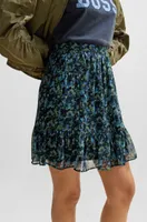 Seasonal-print mini skirt with volant hem