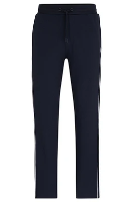 Regular-fit tracksuit bottoms with contrast piping