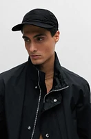 Water-repellent six-panel cap with metal logo