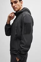 Mixed-material hooded jacket with patterned trims