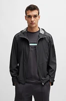 Mixed-material hooded jacket with patterned trims