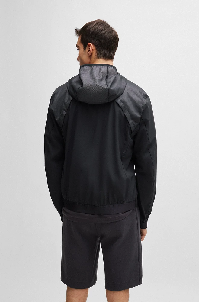 Mixed-material hooded jacket with patterned trims