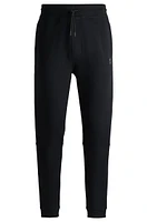 Cotton-terry tracksuit bottoms with logo patch