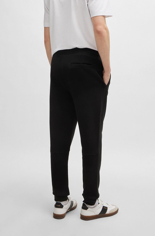 Cotton-terry tracksuit bottoms with logo patch