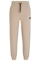 Stretch-cotton tracksuit bottoms with stacked logo