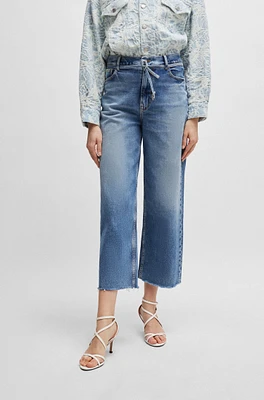 Blue jeans with belt detail