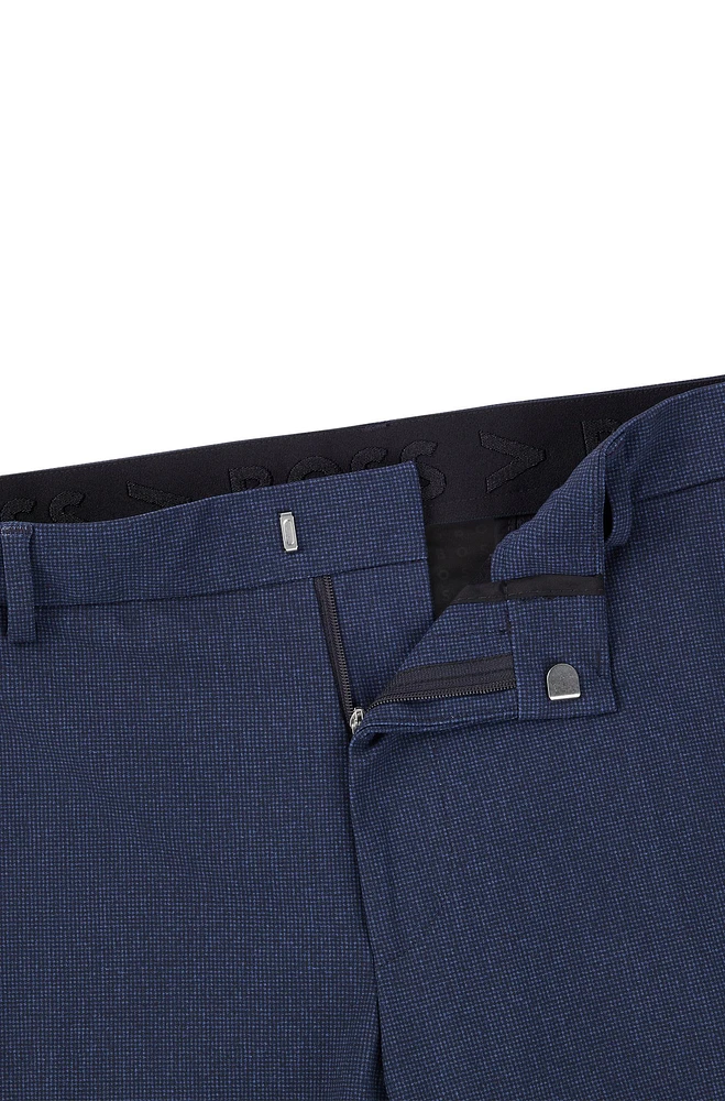 Pantalones slim fit de punto elástico técnico con microdibujo