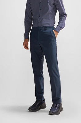 Pantalones slim fit de punto elástico técnico con microdibujo