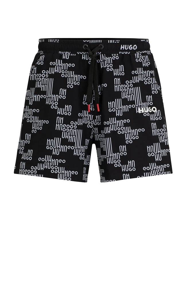 Fully lined swim shorts with all-over logos