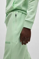 Open-hem tracksuit bottoms with 3D-molded logo