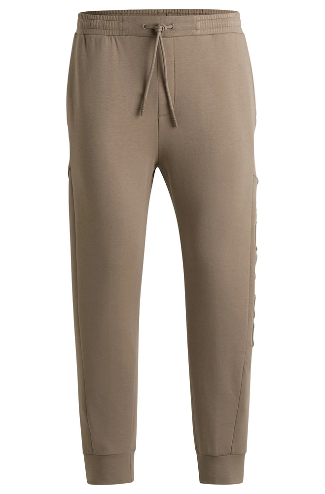 BOSS - Stretch-cotton tracksuit bottoms with embossed logo Light Green