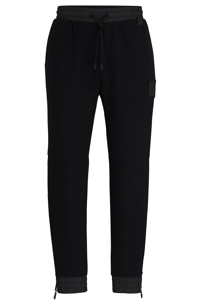 Stretch-cotton tracksuit bottoms with logo patch