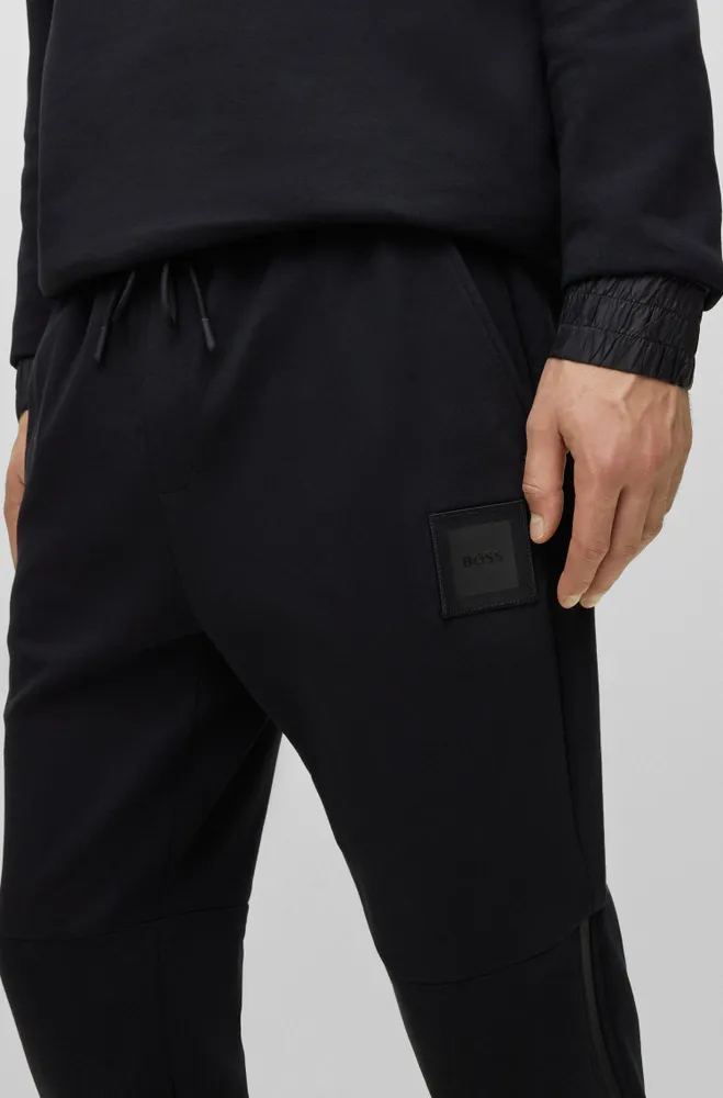 Stretch-cotton tracksuit bottoms with logo patch