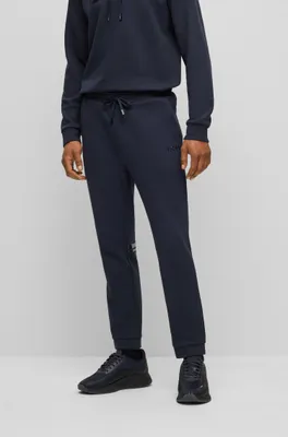 Cotton-piqué tracksuit bottoms with logo detail