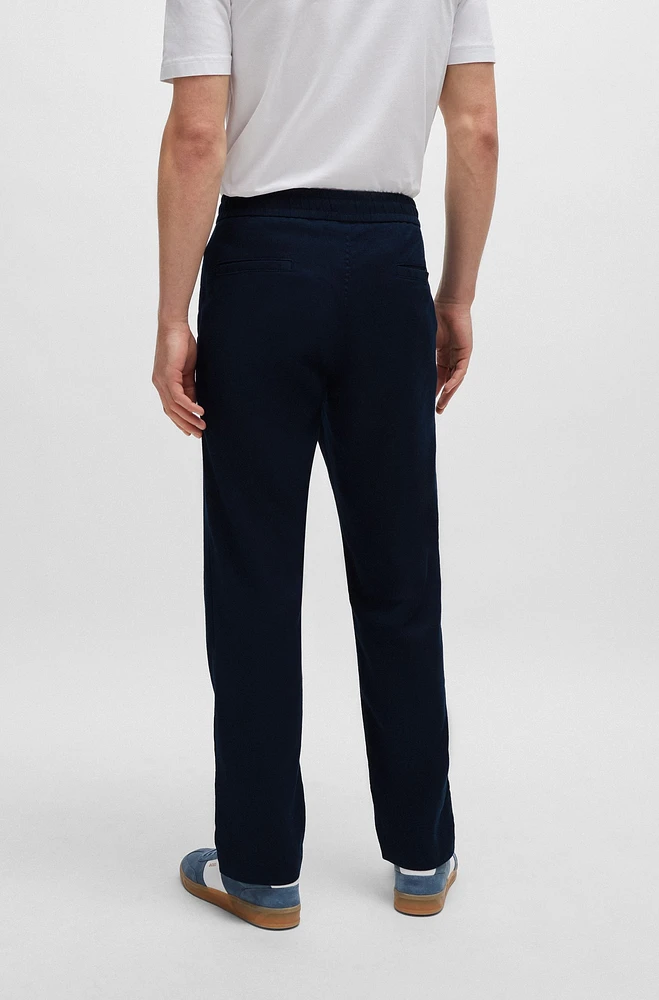 Pantalones tapered fit de mezcla lino