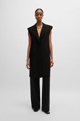 Sleeveless jacket with concealed closure and signature lining