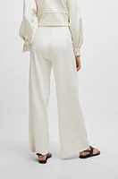 Piqué jersey trousers with front pleats