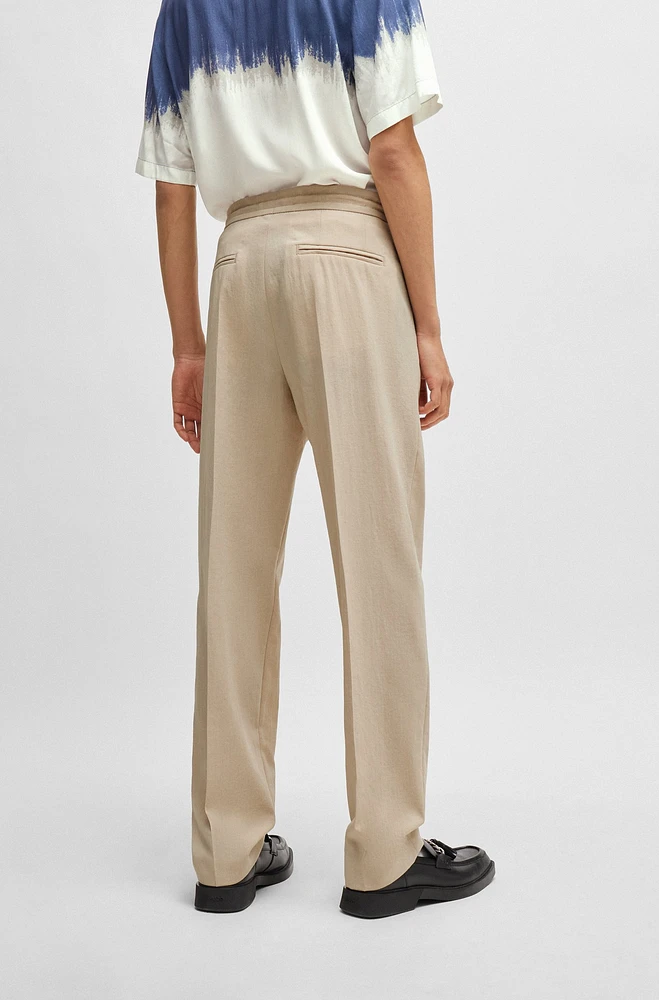 Pantalones de corte moderno en material con apariencia lino