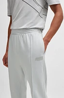 Tracksuit bottoms with logo artwork