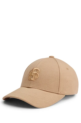 Cap with embroidered double monogram