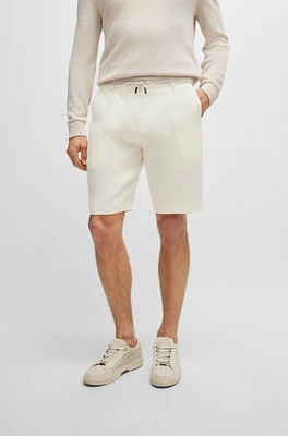 Herringbone-linen shorts with front pleats and drawcord