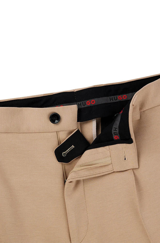 Pantalones de corte moderno en punto elástico técnico