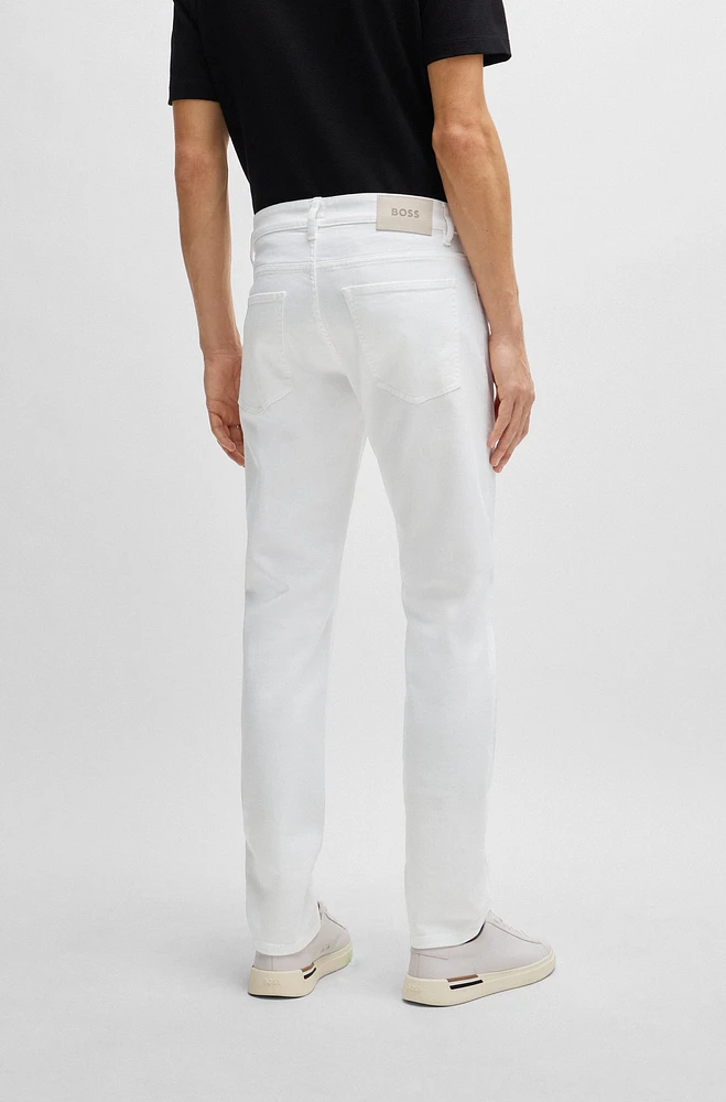 Vaqueros slim fit de denim blanco con tacto cashmere