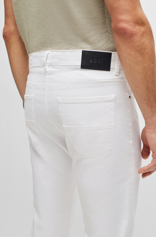 Vaqueros tapered fit de tejido vaquero elástico italiano color blanco