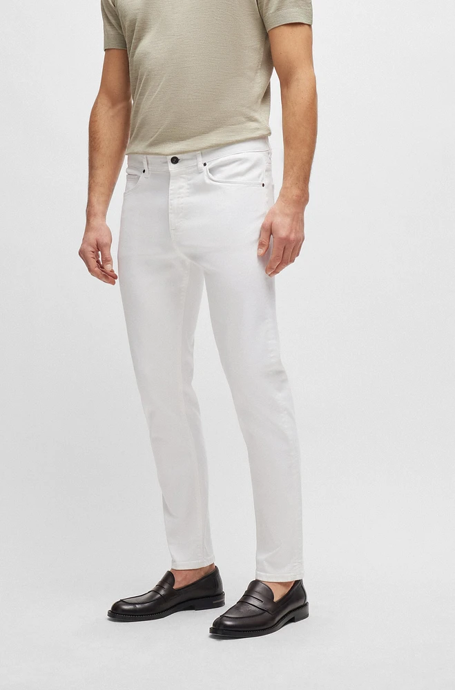 Vaqueros tapered fit de tejido vaquero elástico italiano color blanco