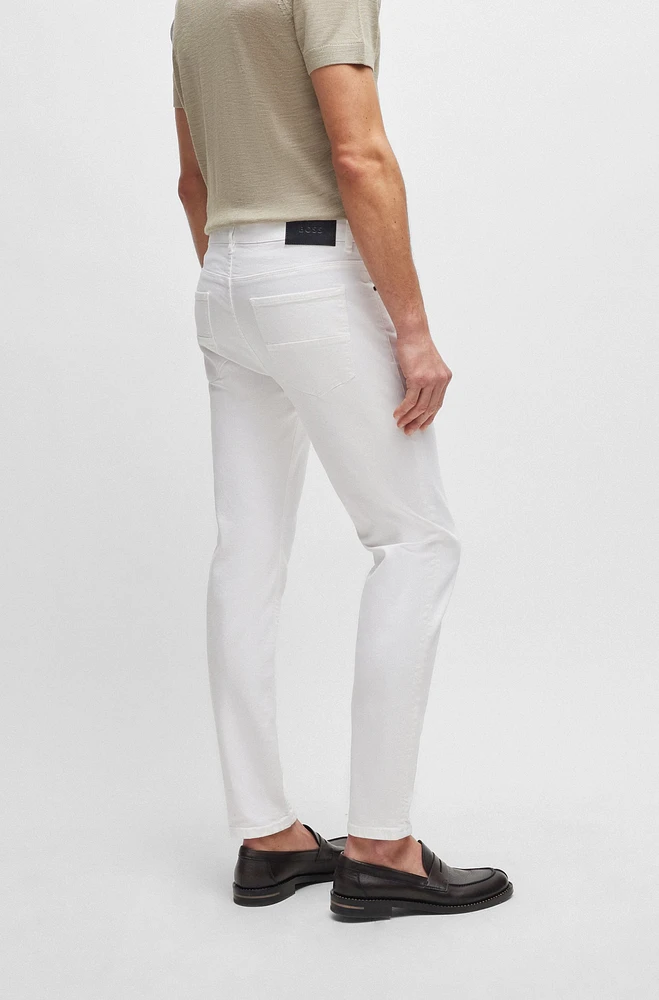 Vaqueros tapered fit de tejido vaquero elástico italiano color blanco