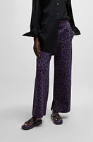 NAOMI x BOSS tracksuit bottoms with leopard print